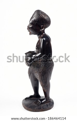 a wooden statue of african tribe man,african crafts