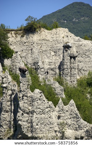 Zone (BS),Italy,  Nature Reserve of the Pyramids of Zone of erosion, the earth's pyramids topped by large hats rock,originated by the erosive action on the original deposit moraine