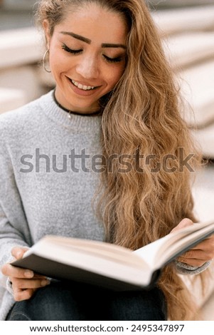 Similar – Image, Stock Photo Thoughtful woman reading book in living room