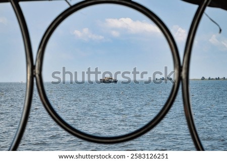 Similar – Image, Stock Photo View through a circular recess of a soccer goal to the opposite goal.