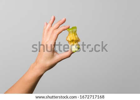 Image, Stock Photo Hand holding core of an apple