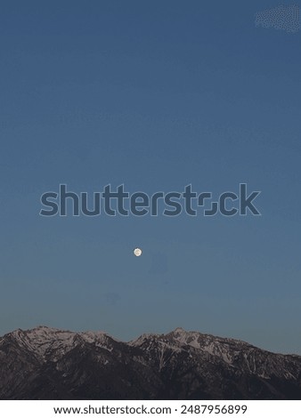 Similar – Foto Bild Vollmond über verschneiten Bergen