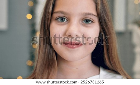 Similar – Image, Stock Photo Portrait of girl with her trendy sweater over her head having fun. Woman with tied hair, cold, hiding under her pink sweater. Fashion photo.