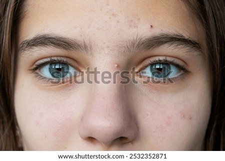 Similar – Image, Stock Photo Portrait of girl with her trendy sweater over her head having fun. Woman with tied hair, cold, hiding under her pink sweater. Fashion photo.