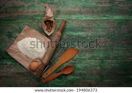 Retro kitchen tools on wooden background