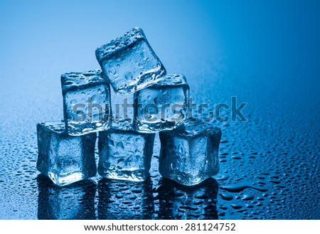 Ice cubes with water drops and reflaction.