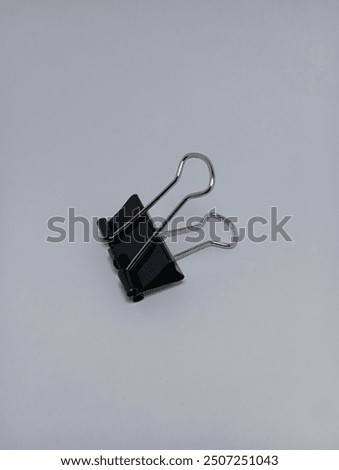 Similar – Foto Bild Ein Binder Clips Kreis auf blauem Hintergrund