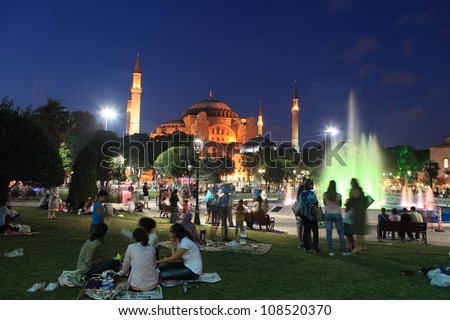 ISTANBUL, TURKEY- JULY 20: Breaking of the fast opening of Turkish Muslims in Sultanahmet Square on July 20, 2012 in Istanbul,Turkey