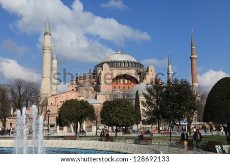 ISTANBUL, TURKEY - FEBRUARY 18 : Tourists near Hagia Sophia on February 18, 2013 in Istanbul, Turkey. Hagia Sophia is a former Orthodox basilica, later a mosque, and now a museum.