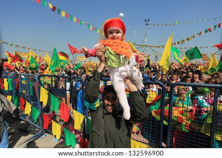 DIYARBAKIR,TURKEY - MARCH 21: Kurds celebrating their traditional feast Newroz that means \'new day\' in kurdish on March 21, 2013 in Diyarbakir, Turkey.