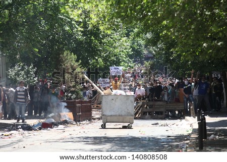 ISTANBUL,TURKEY-JUNE 1: Protesters in Taksim continue as minor scuffles break out and protesters lob fireworks at officers. Police removed barricades around the square on June 1,2013 in Istanbul.
