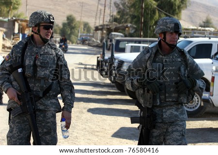 MAXMUR CITY, IRAQ - JANUARY 26: Unidentified USA soldiers stands guard in a check point on January 26, 2007 in Maxmur, Iraq.
