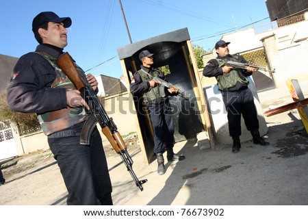 KIRKUK, IRAQ - FEBRUARY 2: Unidentified Iraqi soldiers stand guard at a check point on February 2, 2007 in Kirkuk, Iraq.