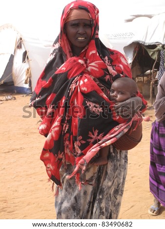 DADAAB, SOMALIA-AUGUST 15: Unidentified woman & child lives in the Dadaab refugee camp where thousands of Somalis wait for help because of hunger on August 15, 2011 in Dadaab, Somalia.