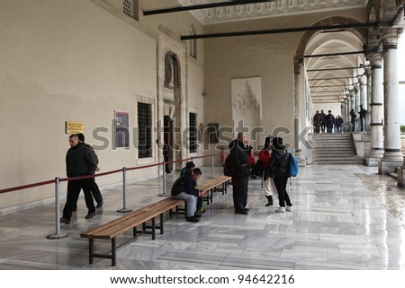 ISTANBUL,TURKEY- JANUARY 28 :Tourists go through the Gate of Felicity, the entrance into the Inner Court also known as the Third Courtyard in the Topkapi Palace on January 28, 2012 in Istanbul,Turkey