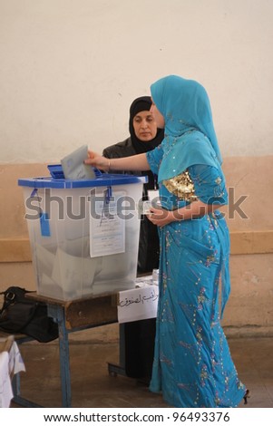 ARBIL, IRAQ - MARCH 07: Kurds flee to election centers to vote for the Iraqi General Elections on March 7, 2010 in the capital of Kurdistan, Arbil, Iraq