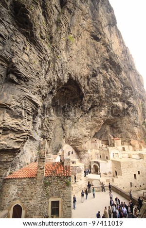 TRABZON, TURKEY - MAY 26: Tourists visit Sumela Monastery on May 26, 2011 in Trabzon,Turkey. Sumela is 1600 year old ancient Orthodox monastery.