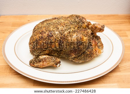 Whole roasted chicken on plate