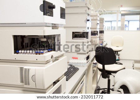 Research laboratory, no people, clean white, selective focus