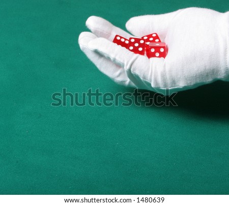 Dices being thrown in a craps game, or yatzee or any kind of dice involved game, Dices are a clear red color on a green felt table