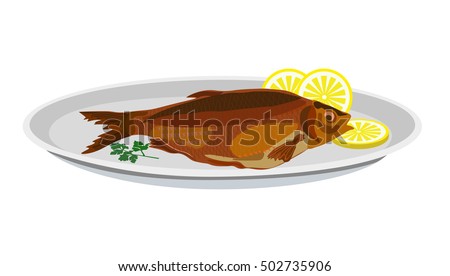 Fried fish and lemon on a plate