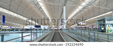 HONG KONG, CHINA - APRIL 19: Airport lobby on April 19, 2014 in Hong Kong, China. The airport is also colloquially known as Chek Lap Kok Airport as it is located in island of Chek Lap Kok.