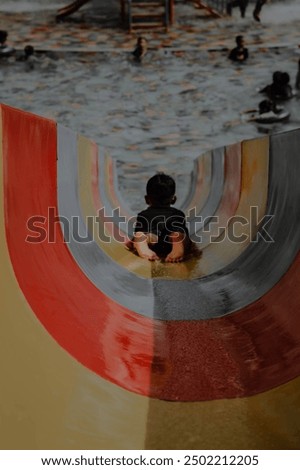 Similar – Children play on surfboard in mountain lake