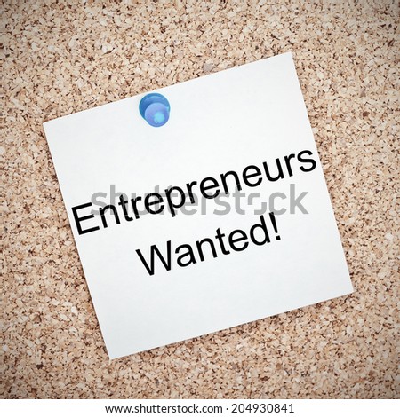The phrase Entrepreneurs Wanted typed onto a paper and pinned to a cork notice board