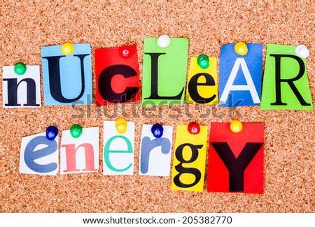 The phrase nuclear energy  in cut out magazine letters pinned to a cork notice board