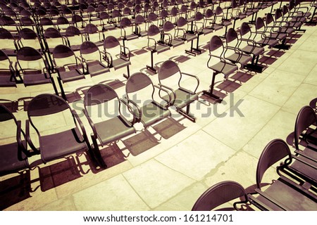Rows of chairs at outdoors concert hall. Vintage style processing image