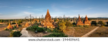 Travel landscapes and destinations panorama view. Tourists horse carriage in front of ancient Mahazedi Pagoda. Amazing architecture of old Buddhist Temples at Bagan Kingdom, Myanmar (Burma)