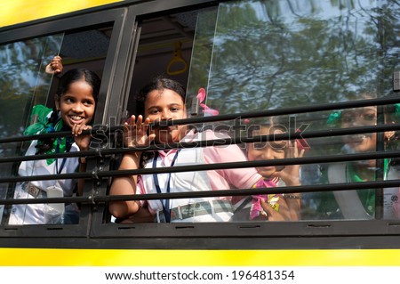KOCHI, INDIA - FEBRUARY 25: Unidentified school children in uniform going home after classes at primary school by school bus on February 25, 2013. India, Cochin (Kochi),  Kerala