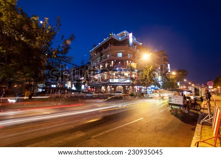 PHNOM PENH, CAMBODIA - DEC 29, 2013: Scene of night life at most popular tourist street near Mekong river in capital city Phnom Penh, Cambodia