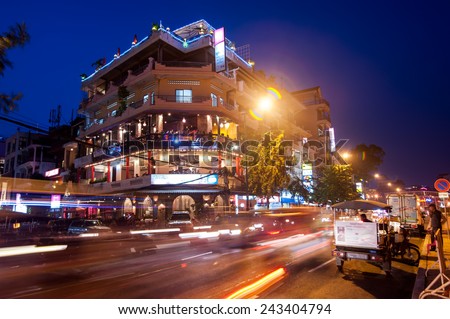 PHNOM PENH, CAMBODIA - DEC 29, 2013: Scene of night life at most popular tourist street near Mekong river in capital city Phnom Penh, Cambodia