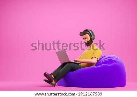 Handsome beard cartoon character man in yellow t-shirt with headphones work with laptop at purple bean bag armchair over pink background. 3d render illustration.