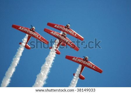 GAINESVILLE, FL - APRIL 15: Aeroshell Aerobatic Team turn away during a barrel roll maneuver at  Heart of Florida Airshow April 15, 2007 in Gainesville, FL.