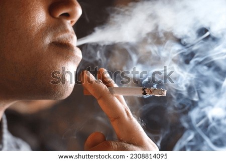 Similar – Image, Stock Photo Young man smoking cigarette in the night