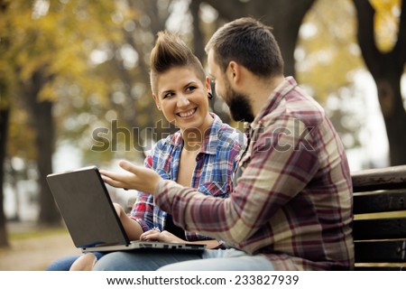 Young Urban People Outdoor Using Computer