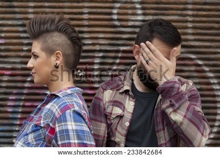 Young Urban People With Graffiti in Background