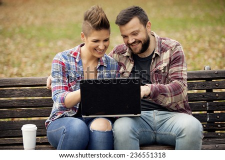 Young Urban People Outdoor Using Computer
