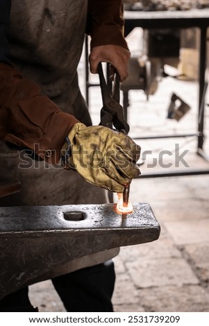 Similar – Image, Stock Photo Blacksmith hands forging molten metal on anvil