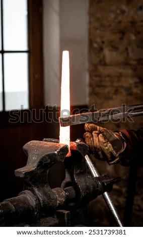 Similar – Image, Stock Photo Blacksmith hands forging molten metal on anvil