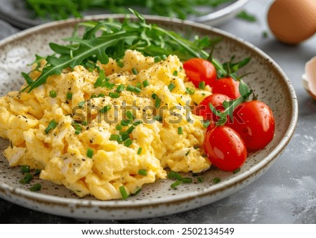 Similar – Image, Stock Photo Scrambled eggs in a blue plate, top view on a yellow table.