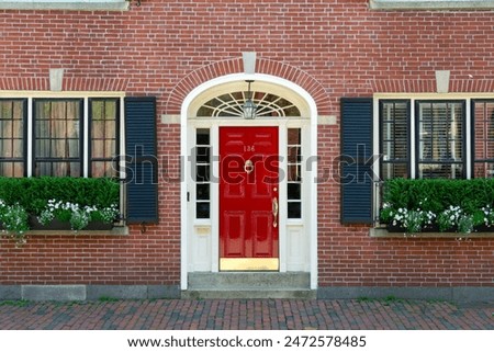 Similar – Image, Stock Photo Brick facade with window and unicorn balloon