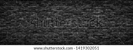 black brick wall background. dark stone texture 商業照片 © 