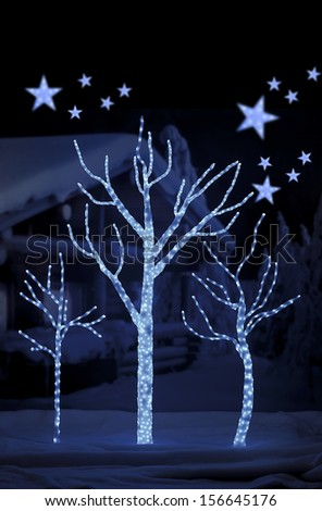 stars on background of defocused blue lights for Christmas