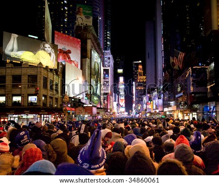 NEW YORK - DEC 31: Pedestrians gather in Times Square for New Year\'s Eve celebrations  on December 31, 2008 in New York City.