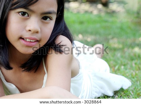 Eight Year Old Asian Child in the Garden