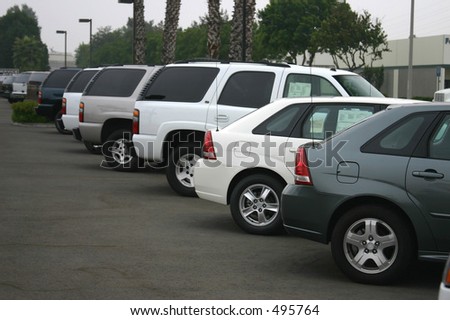 new and used cars at a dealership.