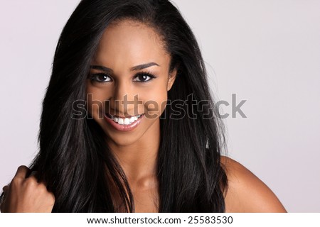 beautiful African-american woman with a broad smile and pretty black hair.